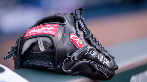 Jun 28, 2023; Kansas City, Missouri, USA; Glove sits on the dugout wall prior to the game between the Cleveland Guardians and the Kansas City Royals at Kauffman Stadium. Mandatory Credit: William Purnell-USA TODAY Sports